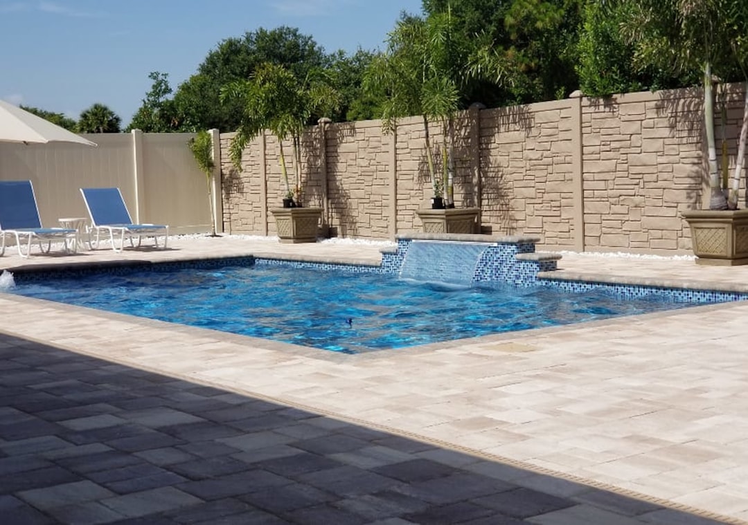 a-luxurious-pool-area-with-a-water-feature-cvcs-wy8kay