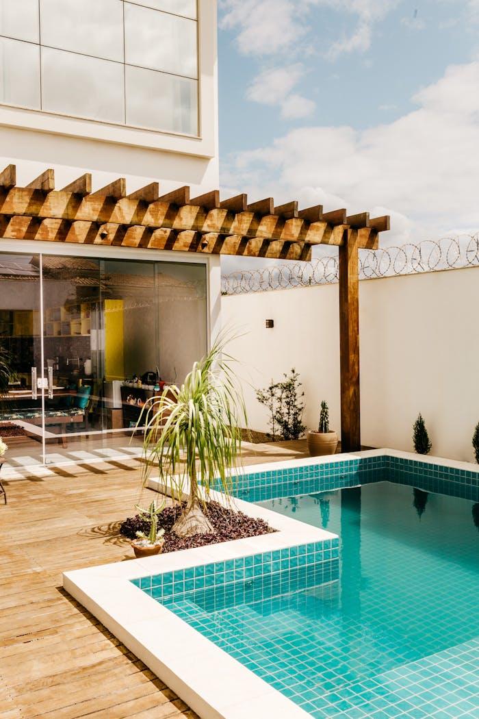 Contemporary villa featuring a relaxing poolside lounge and modern decor.